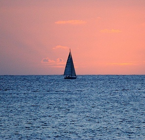 Lone Sailboat at Dusk by Daniel Ramirez